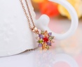 Набір прикрас: кулон і сережки Квітка з кристалами циркону